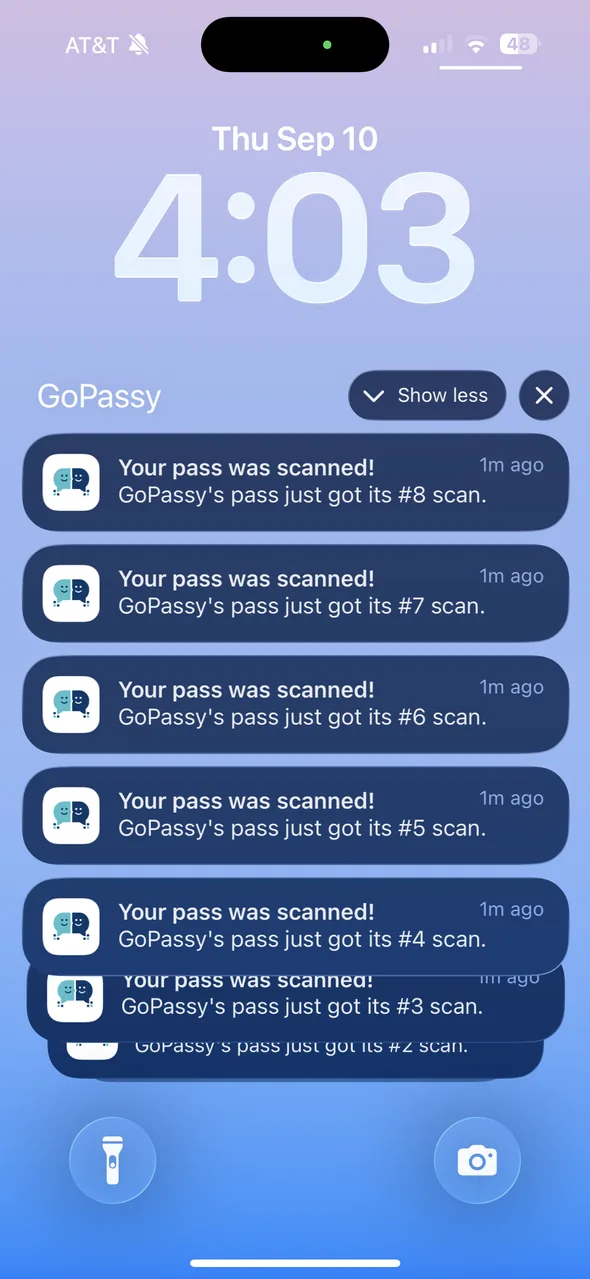 iPhone lock screen with a stack of GoPassy notifications saying the pass was scanned